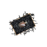 Black tissue paper filling presented in a natural gift box