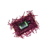 Burgundy tissue paper filling presented in a natural gift box