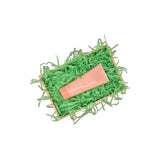 Grass green tissue paper filling presented in a natural gift box