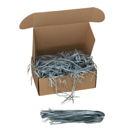 Grey tissue paper shred filler shown in a brown box