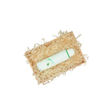 Light tan tissue paper filling presented in a natural gift box