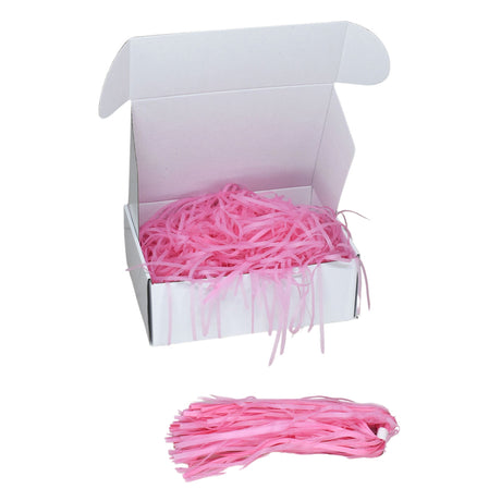 Pale Pink  tissue shred filler displayed in a white gift box