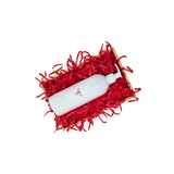 Scarlet red tissue paper filling presented in a natural gift box