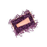 Violet tissue paper filling presented in a natural gift box