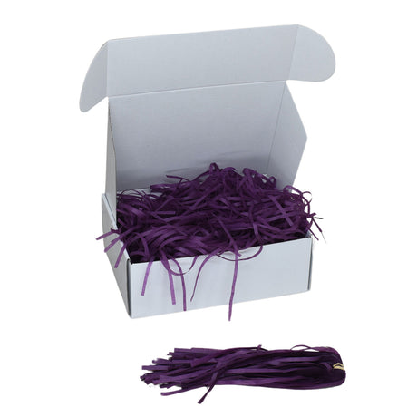 Violet  tissue shred filler displayed in a white gift box