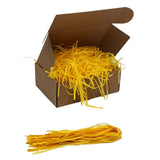 Yellow  tissue paper shred filler shown in a brown box
