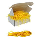 Yellow tissue shred filler displayed in a white gift box