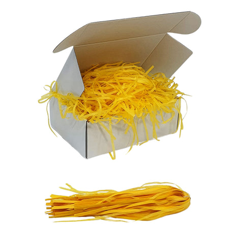Yellow  tissue shred filler displayed in a white gift box